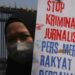 Poster anti-kriminalisasi jurnalis (©Toto Santiko Budi via Shutterstock)
